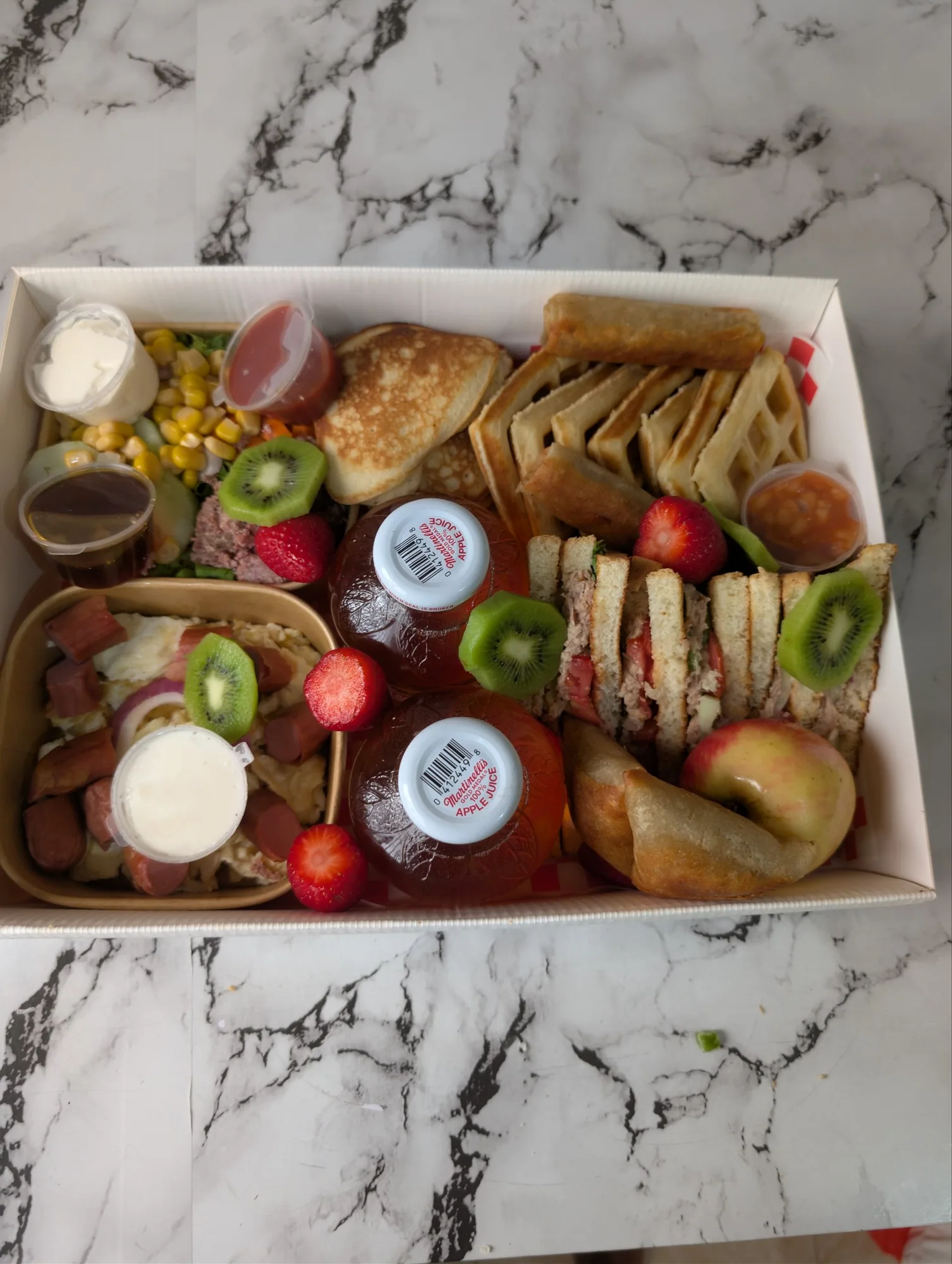 Customizable breakfast package with waffles, fruit, sandwiches and more