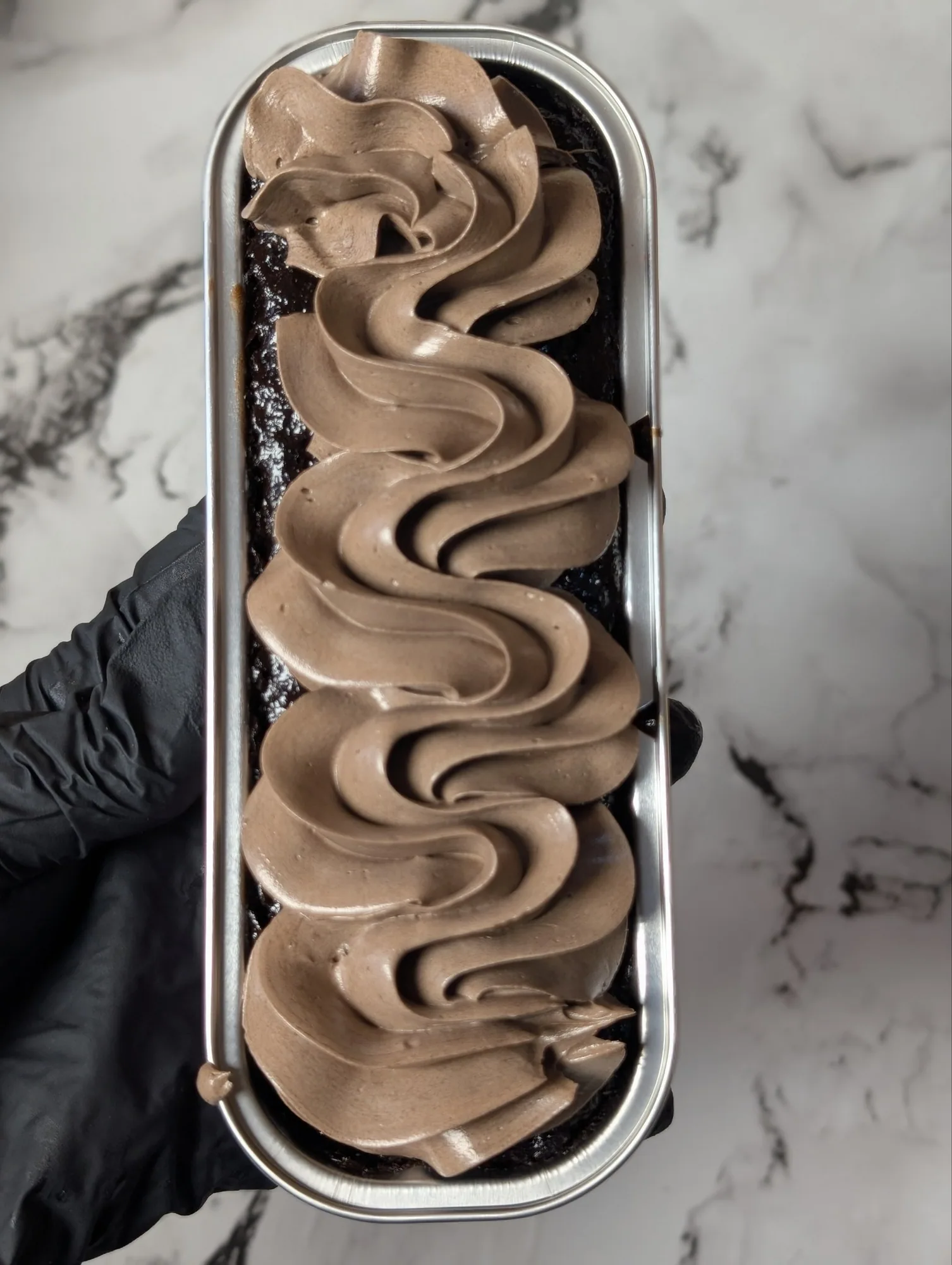 Chocolate foil cake with piped frosting